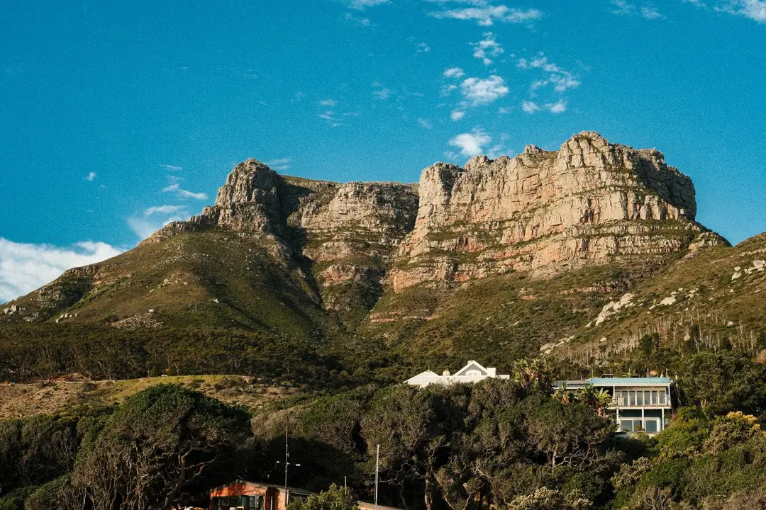 Scenic view of the Twelve Apostles mountain range under a clear blue sky in Cape Town, South Africa.